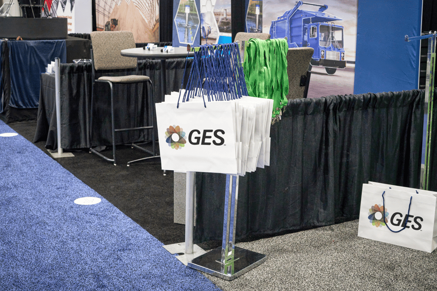 Bag stand product display positioned for visibility in a trade show booth