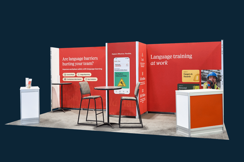 Exhibit Systems+ 10x20 trade show booth with defined zones, counters, and meeting space